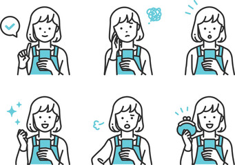 スマホを操作しているシンプルタッチのエプロン姿の主婦