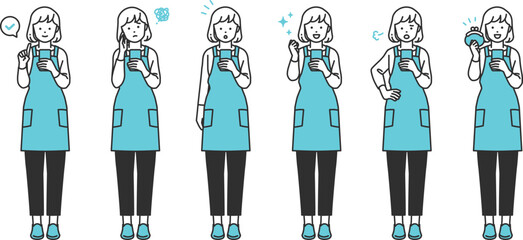 スマホを操作しているシンプルタッチのエプロン姿の主婦