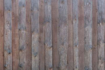 Wooden dark, gray brown board fence
