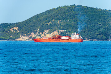 Red and white liquefied natural gas tanker ship in the Mediterranean Sea, Gulf of La Spezia,...