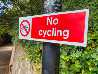 No cycling sign on a post