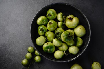 Homegrown green tomatoes still life, selective focus