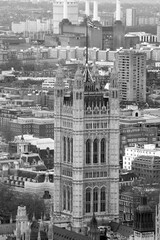 High-angle view of a historical building and the river in black and white. Landscape view UK parliament building from The London Eye cabin.