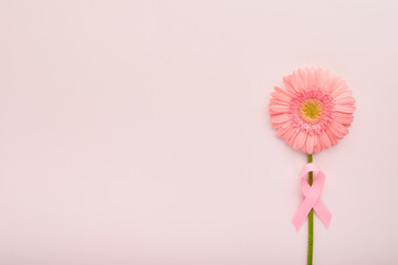 Pink Breast Cancer Awareness Ribbon. Gerbera and pink ribbon on backgrounds. Breast cancer...
