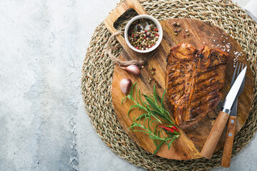 Raw steak t-bone or porterhouse. Steak t-bone or porterhouse in sauce with spices, salt and...