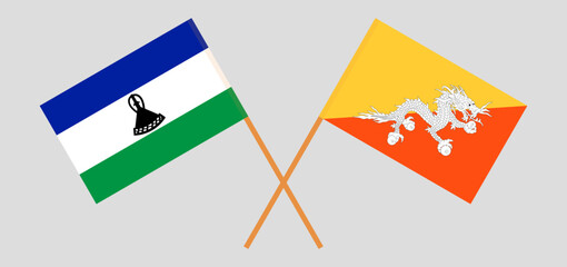 Crossed flags of Bhutan and Lesotho. Official colors. Correct proportion