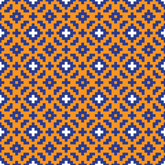 Blue and white cross-stitch knitting pattern on orange background. Blue and white square dots on orange backdrop. Monochrome fabric pattern design for sale. Knitting handicraft art.