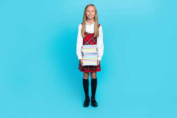 Full size photo of young attractive schoolgirl wear uniform buy new books copybooks for learning...