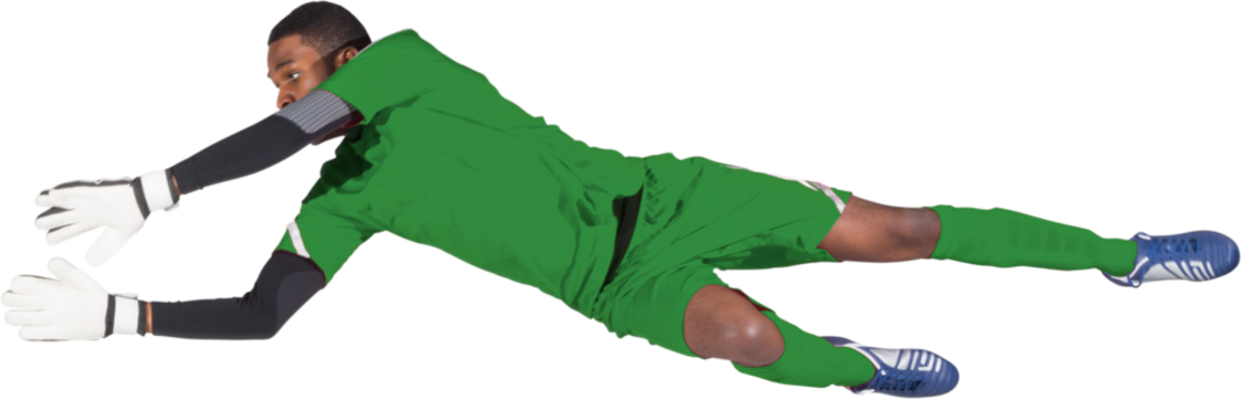 Image of african american male football goalkeeper in green strip diving to block the goal - Powered by Adobe