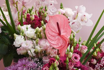Beautiful pink Anthirium in a flower arangement. - obrazy, fototapety, plakaty