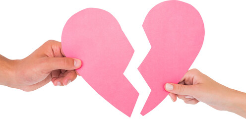 Image of hands of caucasian man and woman holding two halves of broken pink heart