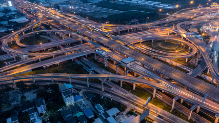 Aerial top view road roundabout interchange in city at night, Aerial view of highway and overpass...