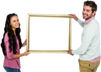 Image of smiling caucasian couple holding golden frame with copy space
