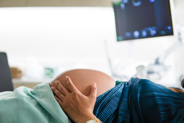 Pregnant woman sleeping in ultrasound room, checking gestational age, hospital, pregnancy,...