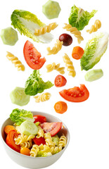 Pasta salad falling into a bowl