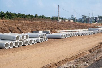 New sewer Concrete drainage pipe. New sanitary sewer, storm drain systems on construction site in...