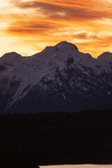 Sunset on the peaks of the Andes Mountains, Views from the San Carlos de Bariloche Circuit, Nahuel Huapi National Park. Patagonia, Argentina.