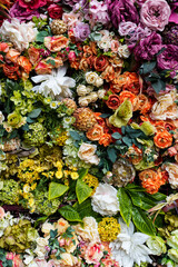 Flowers wall background with amazing red, orange, pink, purple, green and white flowers