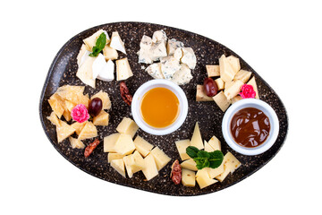 A plate with a variety of cheeses.
