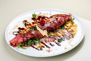 Raw beef tartare with parmesan cheese and wine sauce.