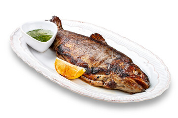 Grilled mackerel with butter and herbs. On a light background.