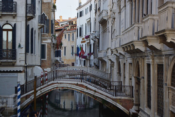 Obraz na płótnie Canvas Scenic canal with gondola, Venice, Italy, in summer
