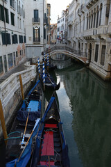 Scenic canal with gondola, Venice, Italy, in summer