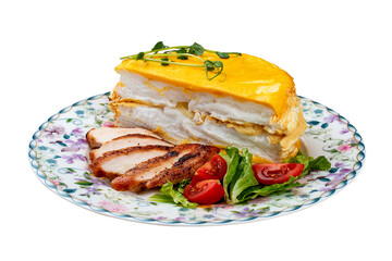Scrambled eggs layered with fried chicken breast and fresh vegetables. Breakfast.