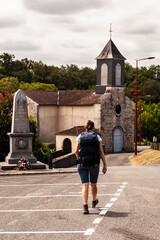 Pilgrim near the Church of Saint-Pierre, Argagnon