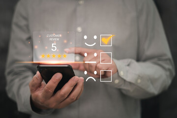 Customer satisfaction feedback survey and rating to service experience online application, Business people Satisfaction Rating score on virtual screen the happy Smile icon with smartphone