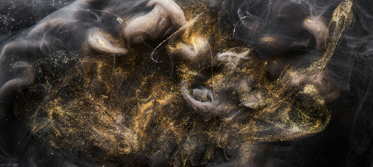 Golden sparkling abstract background, luxury black smoke, acrylic paint underwater explosion, cosmic swirling ink © amixstudio