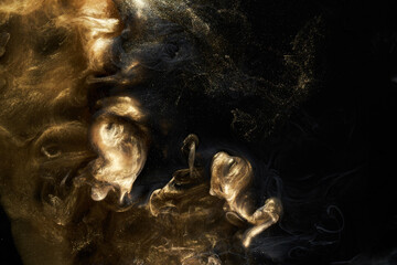 Golden sparkling abstract background, luxury black smoke, acrylic paint underwater explosion, cosmic swirling ink © amixstudio