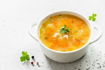 Carrot split pea bacon soup in bowl. Top view, copy space, flat lay.