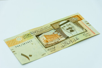 Saudi Arabia riyal banknote on a white background. Selective focus.