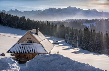 Tatra Mountains, winter, snow, frost. Panorama of the winter Tatra Mountains and peaks at sunset,...