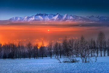 View of the Tatra Mountains from Pieniny. Winter, frost, night and fog, Poland.
Widok z pienin na Tatry. Zima, mróz, noc i mgła. Panorama gór. Polska