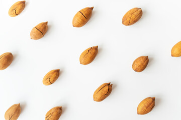 Shelled pecan on a white table. Healthy nuts, vegetarianism. Selective focus.