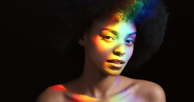 Rainbow prism light, lgbt beauty and black woman glowing face, creative portrait and pride on black background. Transgender equality, gay african person and lesbian with colorful neon shine on skin