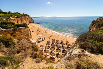 Tremoços beach, in the village of Armação de Perâ, during a magnificent summer day, Algarve,...