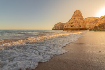 Sunset at Praia da Marinha, with its large rock formations, Algarve, Portugal