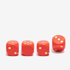 Four red dice on a white background with an abstract combination of numbers in 2023 - the symbol of the coming year.