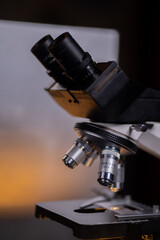 Obraz na płótnie Canvas Close-up shot microscope lens at laboratory.