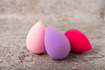 Beauty blender on a marble background.Sponge for makeup cosmetics. Makeup products. Beauty concept. Place for text. Space for copy. Flat lay