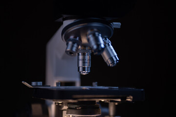 Close-up shot microscope lens at laboratory.