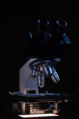 Close-up shot microscope lens at laboratory.