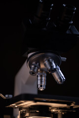 Close-up shot microscope lens at laboratory.