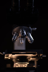 Fototapeta na wymiar Close-up shot microscope lens at laboratory.