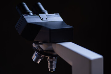Close-up shot microscope lens at laboratory.