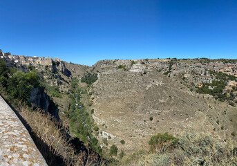Panoramic view on the Gravine di Matera in Basilicata, Italy. The ravines are erosive incisions...