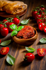 Sun dried and pickled tomatoes with fresh herbs and spices